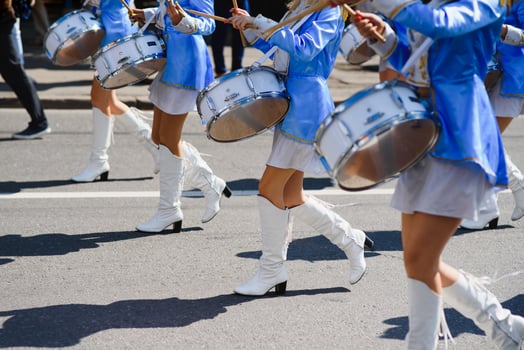 group of majorettes parade through the streets of the city photo