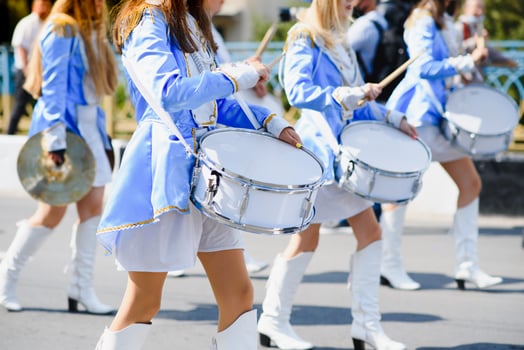 group of majorettes parade through the streets of the city photo