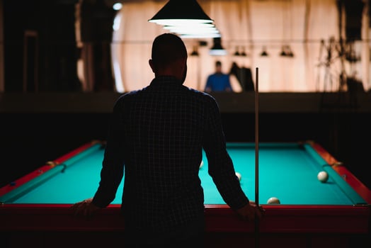 Playing billiard - Close-up shot of a man playing billiard photo