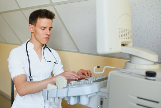 doctor using a modern ultrasound transducer in the clinic photo