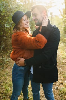 Romantic young couple in love relaxing outdoors in park. photo