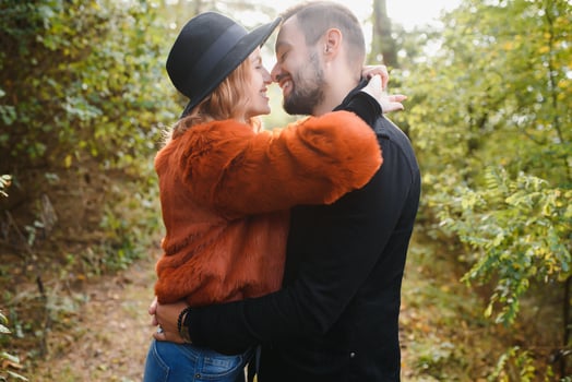 Kissing young couple in love in the autumn park. photo