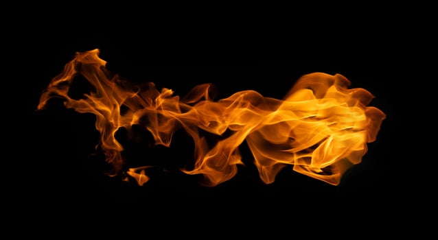 Fire and burning flame of explosive fireball isolated on dark background for graphic design concept photo