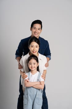 Asian family portrait posing on white background photo