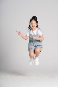 Portrait of a lovely Asian baby girl posing on a white background photo
