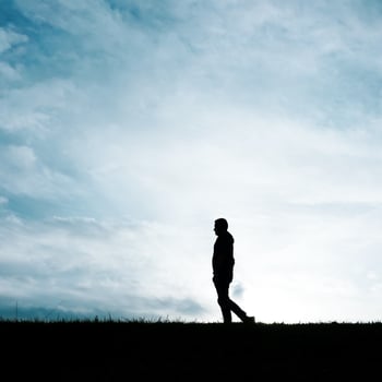 man silhouette in the countryside in the summer and sunset background photo