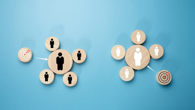 Circular wood with printed target icons and business symbols on light blue background, business goals and objectives concept, business competition, Customer relationship management concept. photo