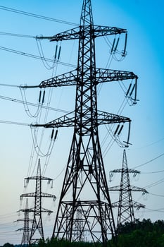 Evening silhouette of electric wire station. Dark electric energy technologies. photo