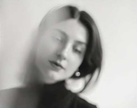 AI generated portrait of pensive woman in blurred black and white photo
