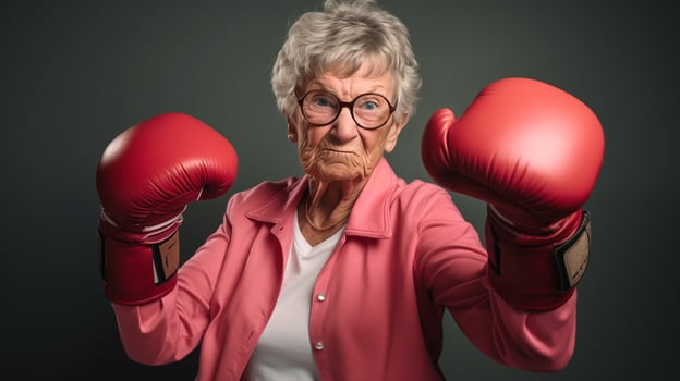 AI generated Portrait of funny old granny in boxing gloves ready to fight, elderly people, active seniors background, crazy grandma photo
