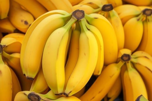 AI generated A close-up of ripe, yellow bananas. Generative AI photo