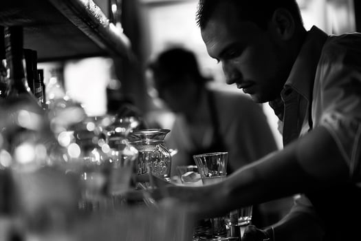 AI generated Photorealistic image of a bartender at work photo