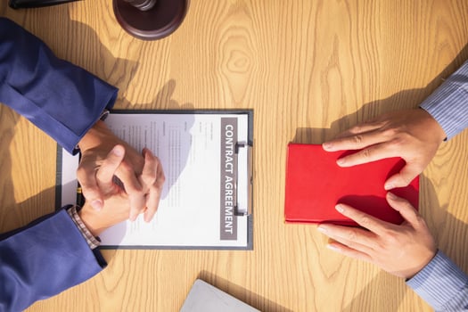A Bible is placed on a table in a lawyer's office so that his client can swear before the Bible that his testimony will be truthful in order to be used in legal investigations and resolutions. photo