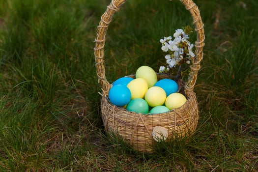Paint eggs for Easter, bright Easter holiday, children paint eggs, colored eggs in a basket, colored eggs on a stand, Holiday background photo