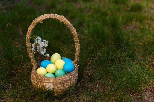 Paint eggs for Easter, bright Easter holiday, children paint eggs, colored eggs in a basket, colored eggs on a stand, Holiday background photo