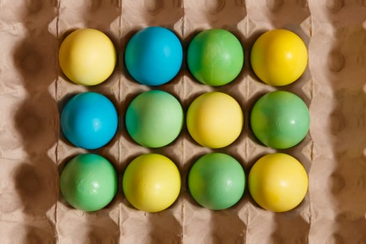 Paint eggs for Easter, bright Easter holiday, children paint eggs, colored eggs in a basket, colored eggs on a stand, Holiday background photo
