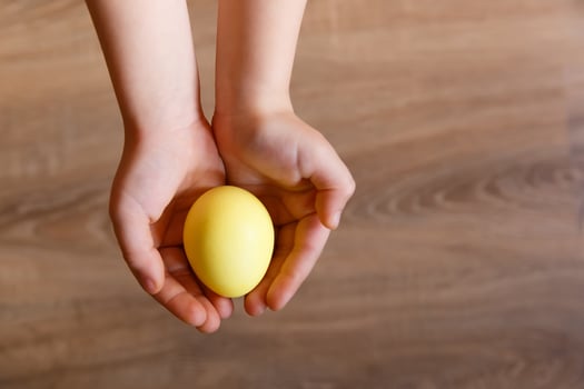 Paint eggs for Easter, bright Easter holiday, children paint eggs, colored eggs in a basket, colored eggs on a stand, Holiday background photo