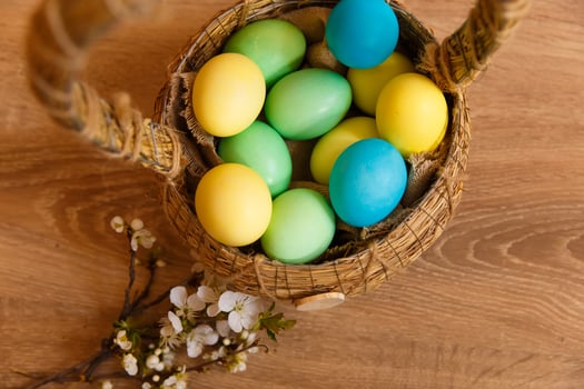 Paint eggs for Easter, bright Easter holiday, children paint eggs, colored eggs in a basket, colored eggs on a stand, Holiday background photo