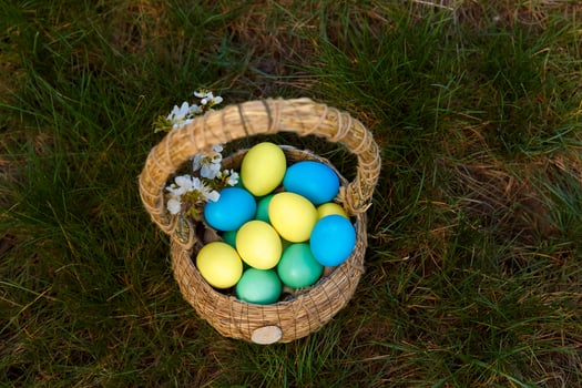 Paint eggs for Easter, bright Easter holiday, children paint eggs, colored eggs in a basket, colored eggs on a stand, Holiday background photo