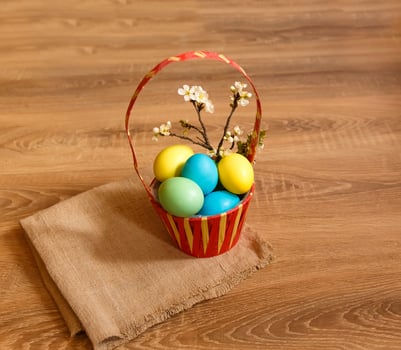 Paint eggs for Easter, bright Easter holiday, children paint eggs, colored eggs in a basket, colored eggs on a stand, Holiday background photo