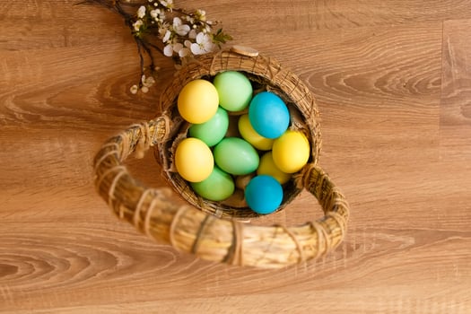 Paint eggs for Easter, bright Easter holiday, children paint eggs, colored eggs in a basket, colored eggs on a stand, Holiday background photo