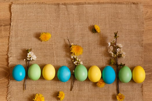 Paint eggs for Easter, bright Easter holiday, children paint eggs, colored eggs in a basket, colored eggs on a stand, Holiday background photo