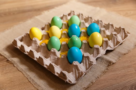 Paint eggs for Easter, bright Easter holiday, children paint eggs, colored eggs in a basket, colored eggs on a stand, Holiday background photo