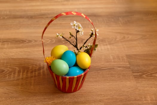 Paint eggs for Easter, bright Easter holiday, children paint eggs, colored eggs in a basket, colored eggs on a stand, Holiday background photo