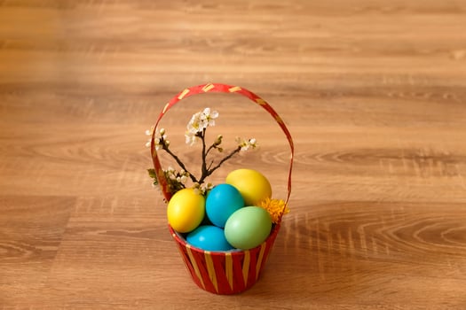 Paint eggs for Easter, bright Easter holiday, children paint eggs, colored eggs in a basket, colored eggs on a stand, Holiday background photo