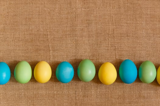 Paint eggs for Easter, bright Easter holiday, children paint eggs, colored eggs in a basket, colored eggs on a stand, Holiday background photo
