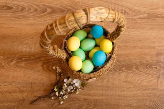 Paint eggs for Easter, bright Easter holiday, children paint eggs, colored eggs in a basket, colored eggs on a stand, Holiday background photo