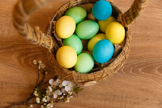 Paint eggs for Easter, bright Easter holiday, children paint eggs, colored eggs in a basket, colored eggs on a stand, Holiday background photo
