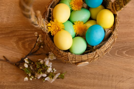 Paint eggs for Easter, bright Easter holiday, children paint eggs, colored eggs in a basket, colored eggs on a stand, Holiday background photo
