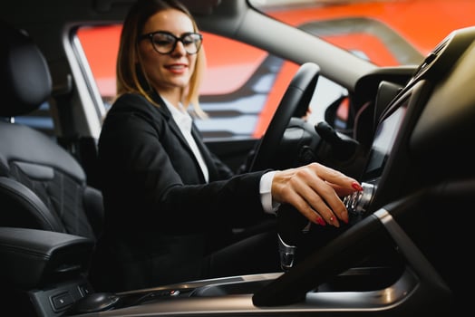 Young business woman driving in her car to work. Successful business concept. business woman driving photo