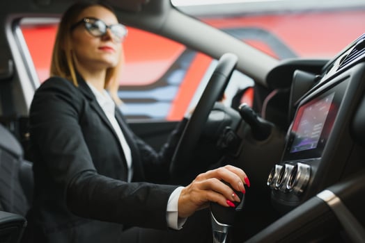 Young business woman driving in her car to work. Successful business concept. business woman driving photo