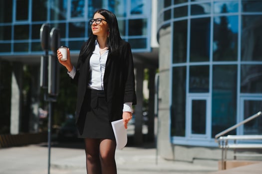 Beautiful business woman on the background of the modern office photo