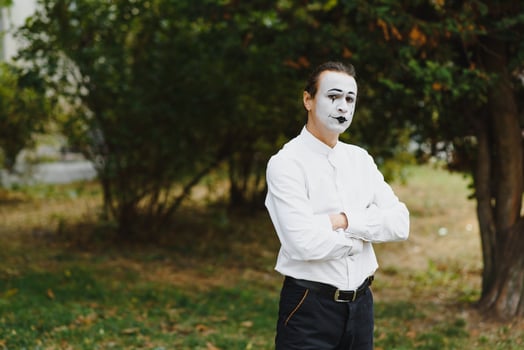 young Funny mime shows something. photo