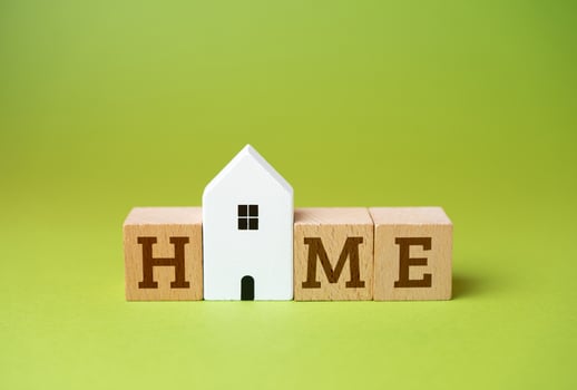 House and the word Home. Comfort and coziness. Your own home. Mortgage loan for the purchase of housing. photo