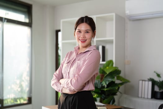 Young successful employee business woman at desk at office. Achievement career concept photo