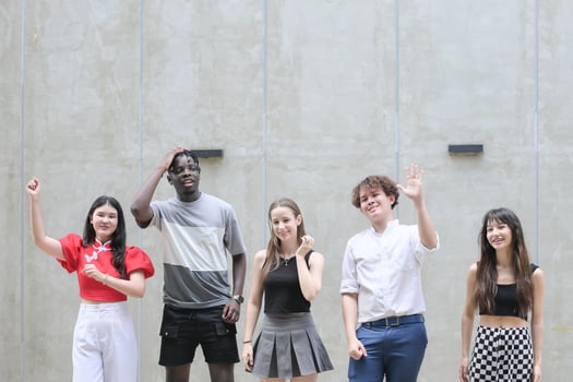Group of young multiethnic friend having fun and laughing outdoors on beautiful summer day photo