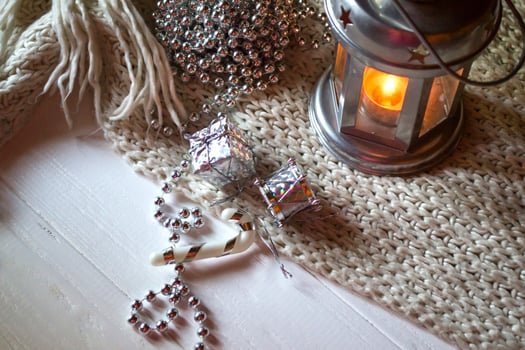 Burning candle and christmas decoration. photo