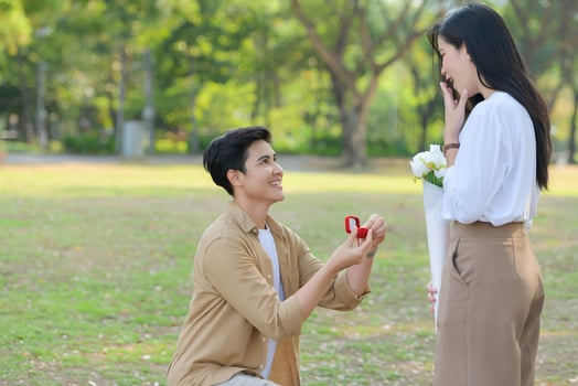 LGBT couple is enjoying a summer vacation in the park, happily showing their love to each other. photo