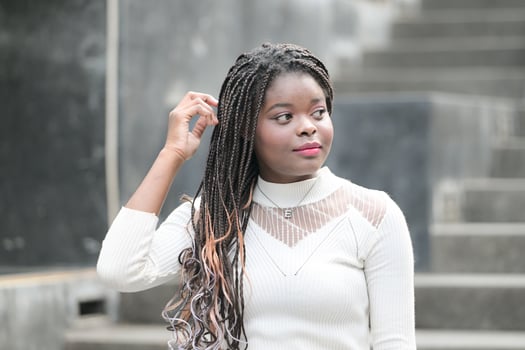 A young woman with his hairstyle and the atmosphere of living in the community. photo