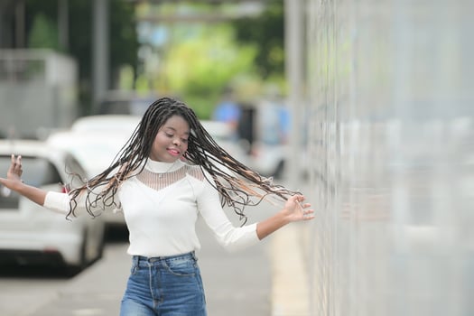 A young woman with his hairstyle and the atmosphere of living in the community. photo