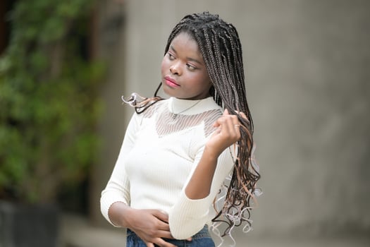 A young woman with his hairstyle and the atmosphere of living in the community. photo