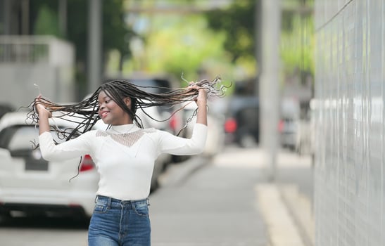 A young woman with his hairstyle and the atmosphere of living in the community. photo