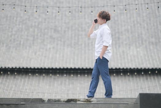 A young man with his hairstyle and the atmosphere of living in the community. photo