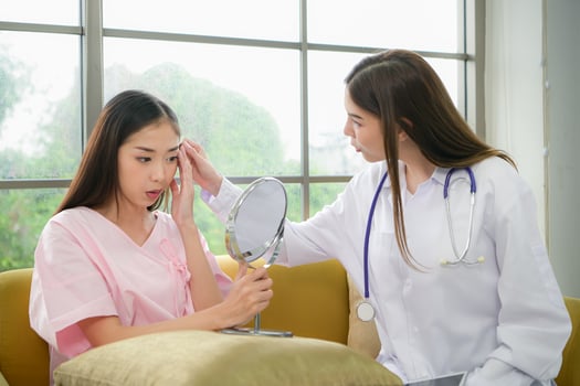 A beauty doctor explains cosmetic surgery and post-operative care. photo