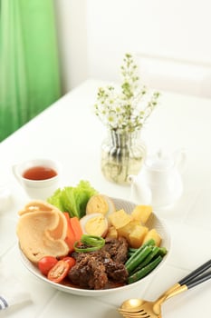 Selat Solo, Braised Beef Steak in Sweet Soy Sauce with Eggs, Potato, and Carrot photo