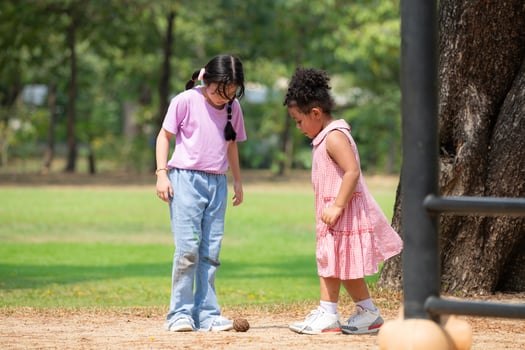 Happy little girls enjoying a stroll in the park photo